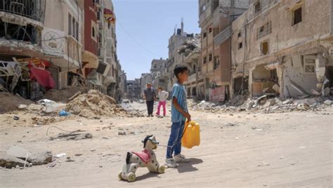Children are drinking from puddles and wading through sewage .